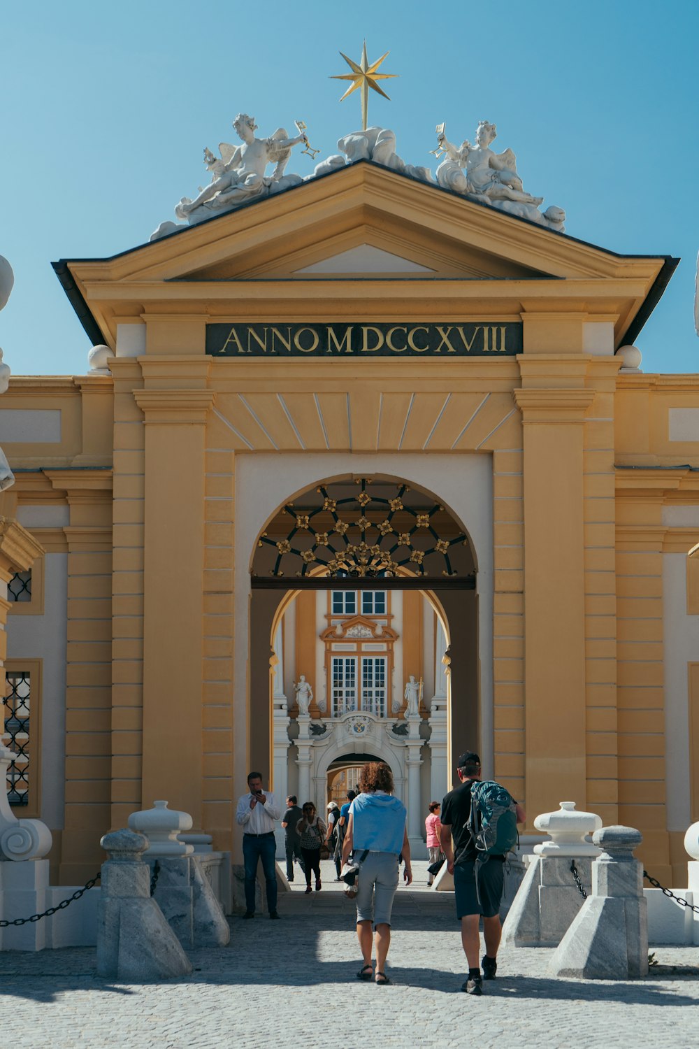 people walking in front of building during daytime