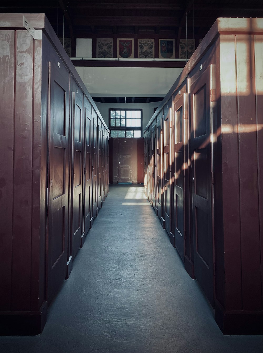 hallway with brown wooden doors