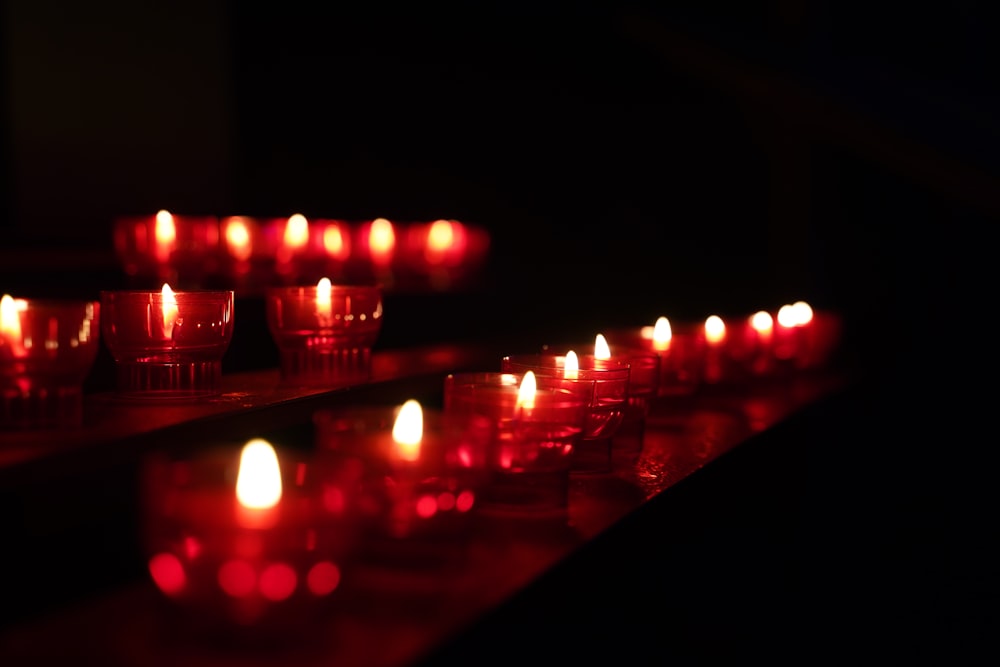 lighted candles on black surface