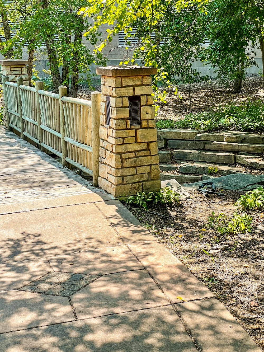 brown wooden fence near green grass during daytime