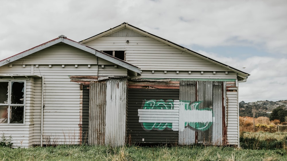 white and green wooden house