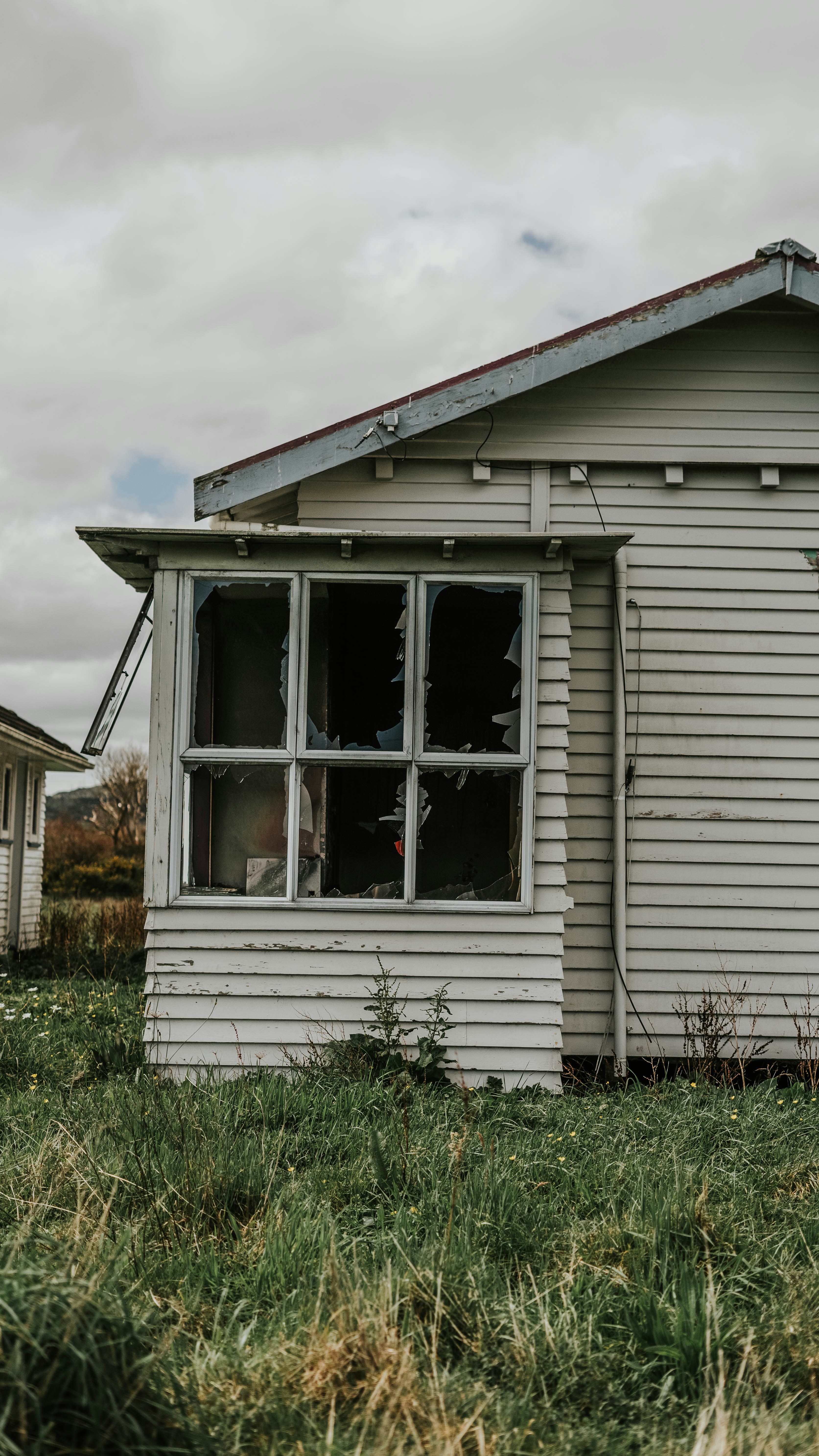 white wooden house with white wooden window