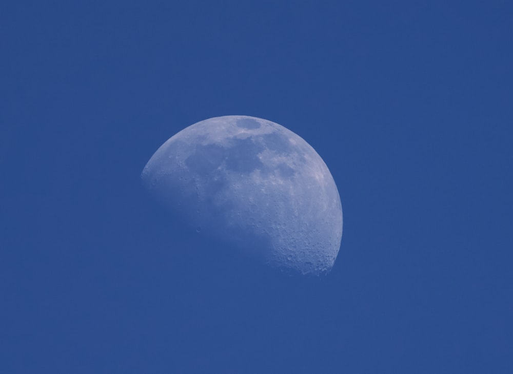white moon on blue sky