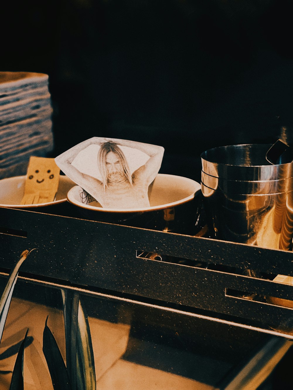 white fedora hat on black wooden table