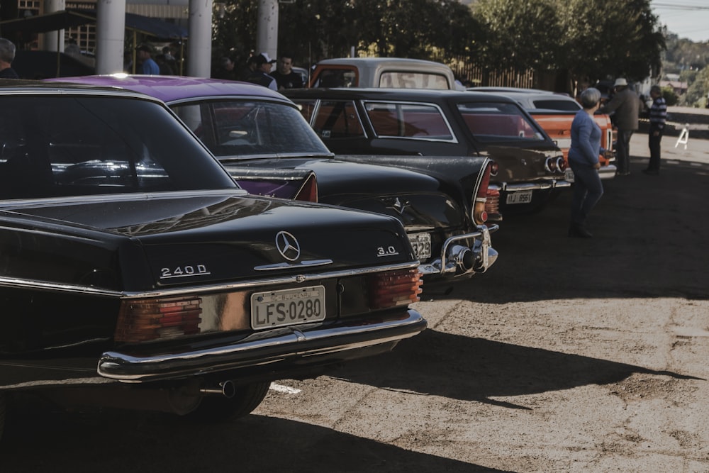 black mercedes benz c class parked on parking lot during daytime