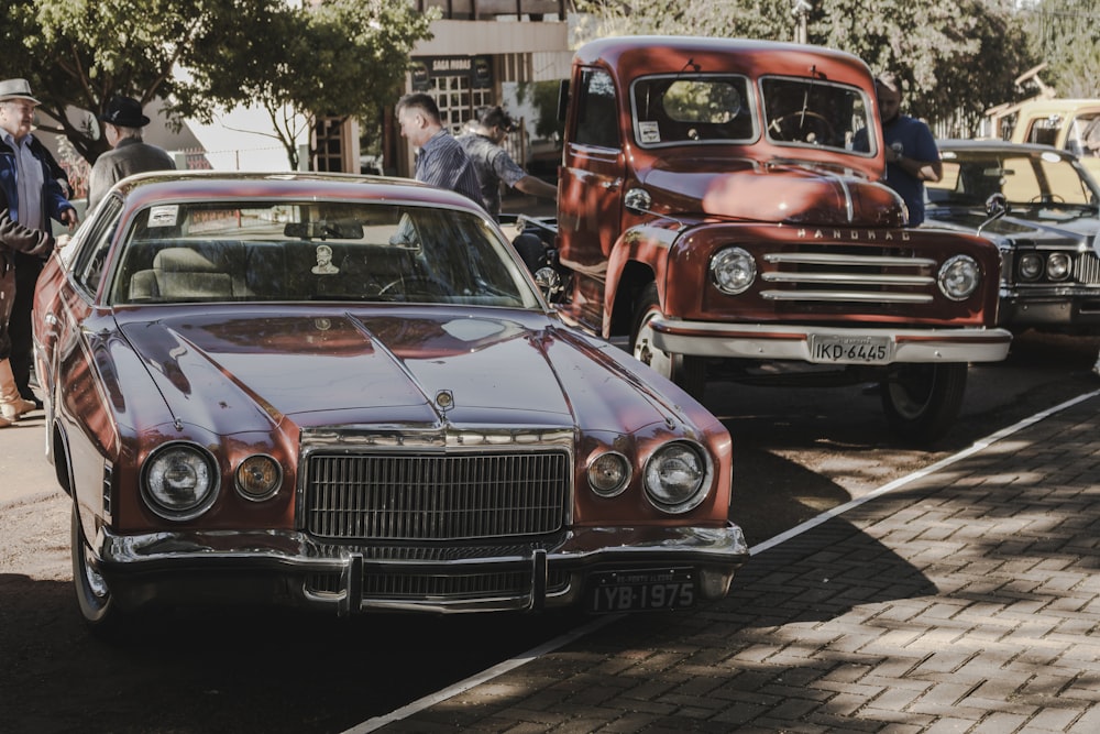 red vintage car on the street