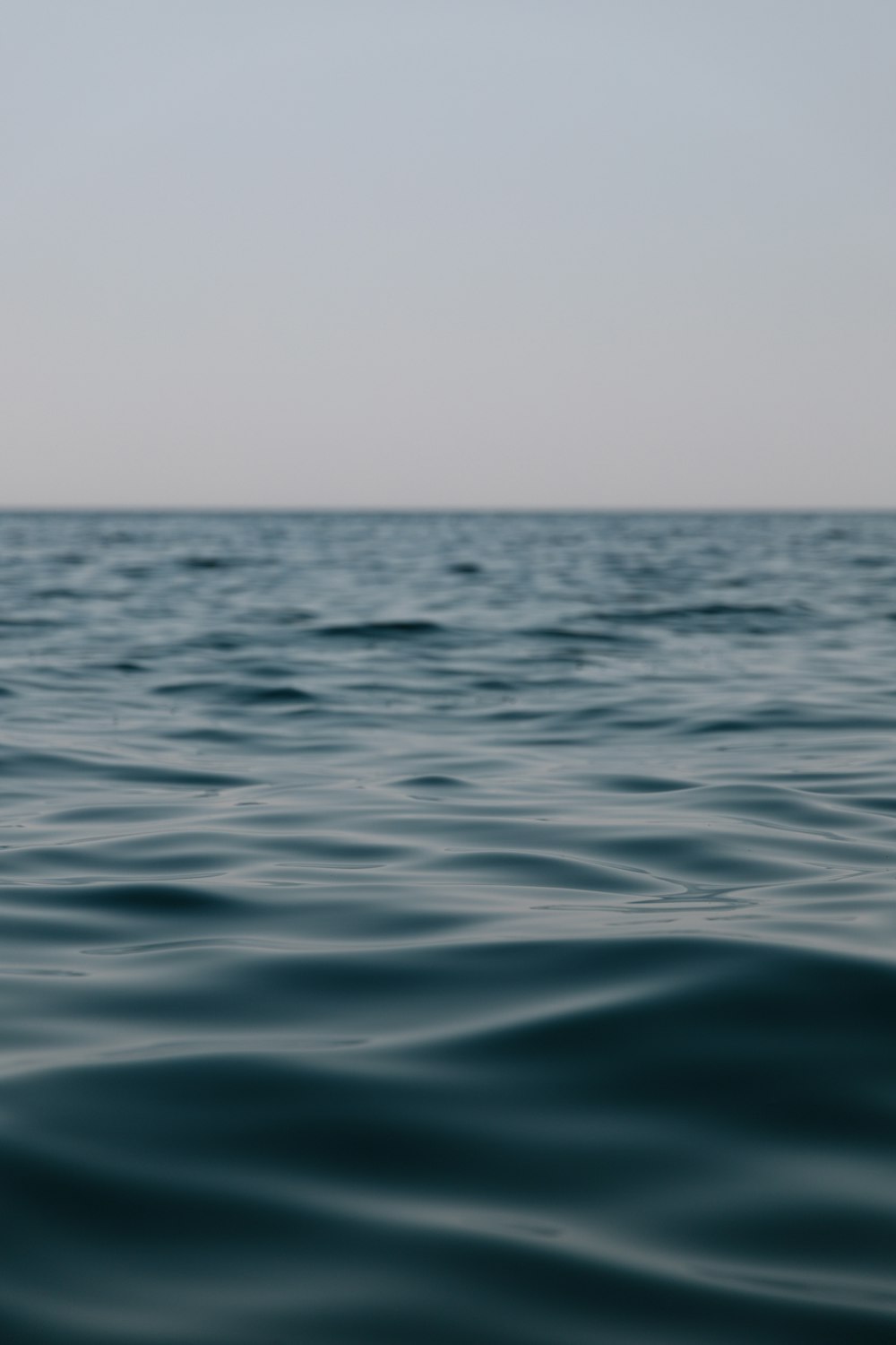 blue sea under white sky during daytime