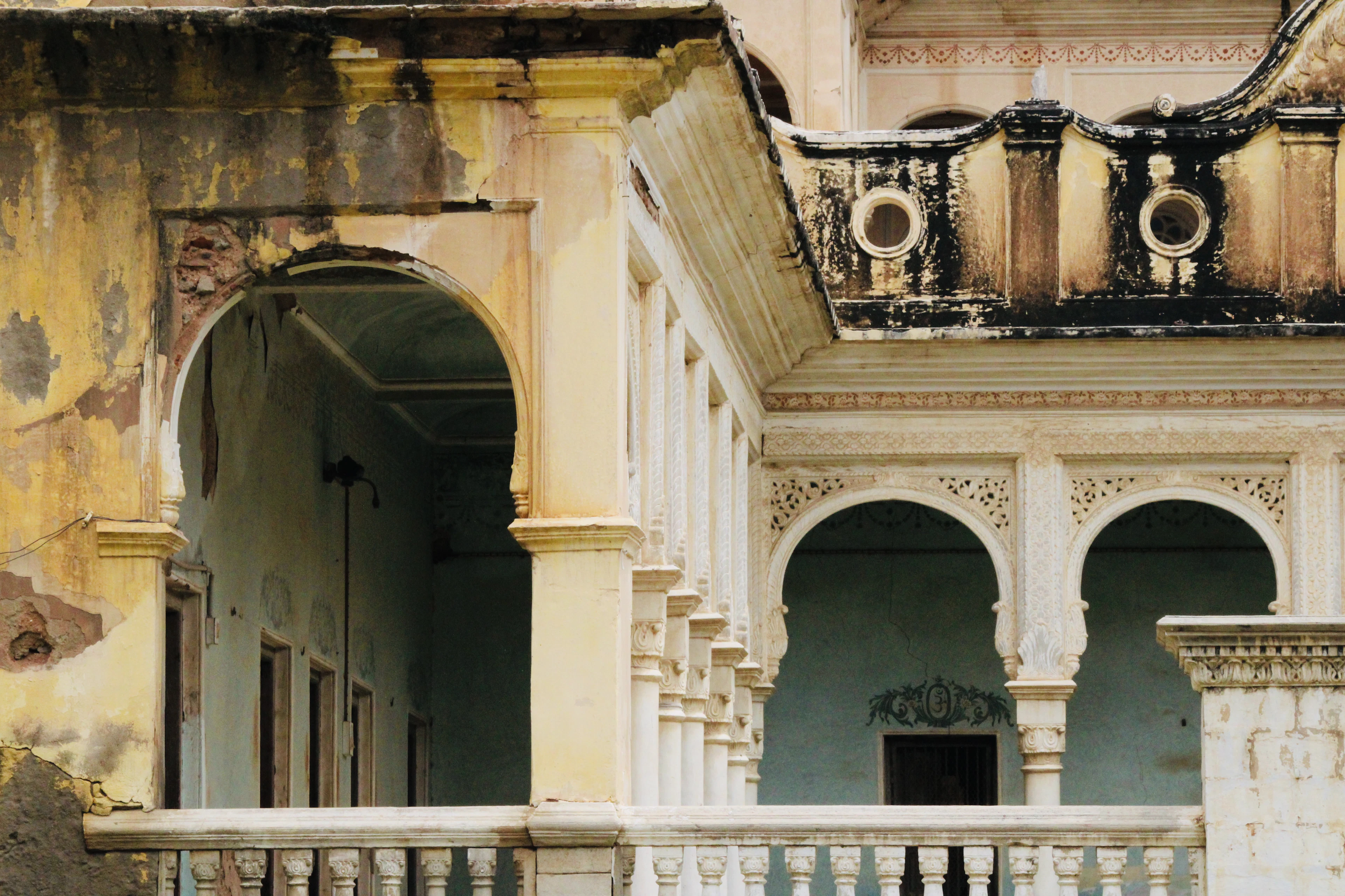 Sandstone arches of a heritage haveli courtyard