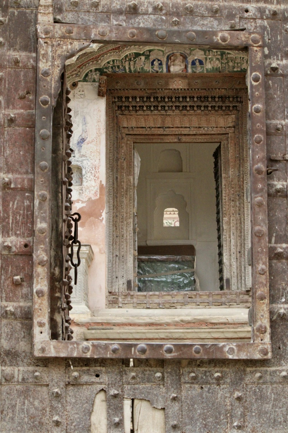 brown concrete building with arch window