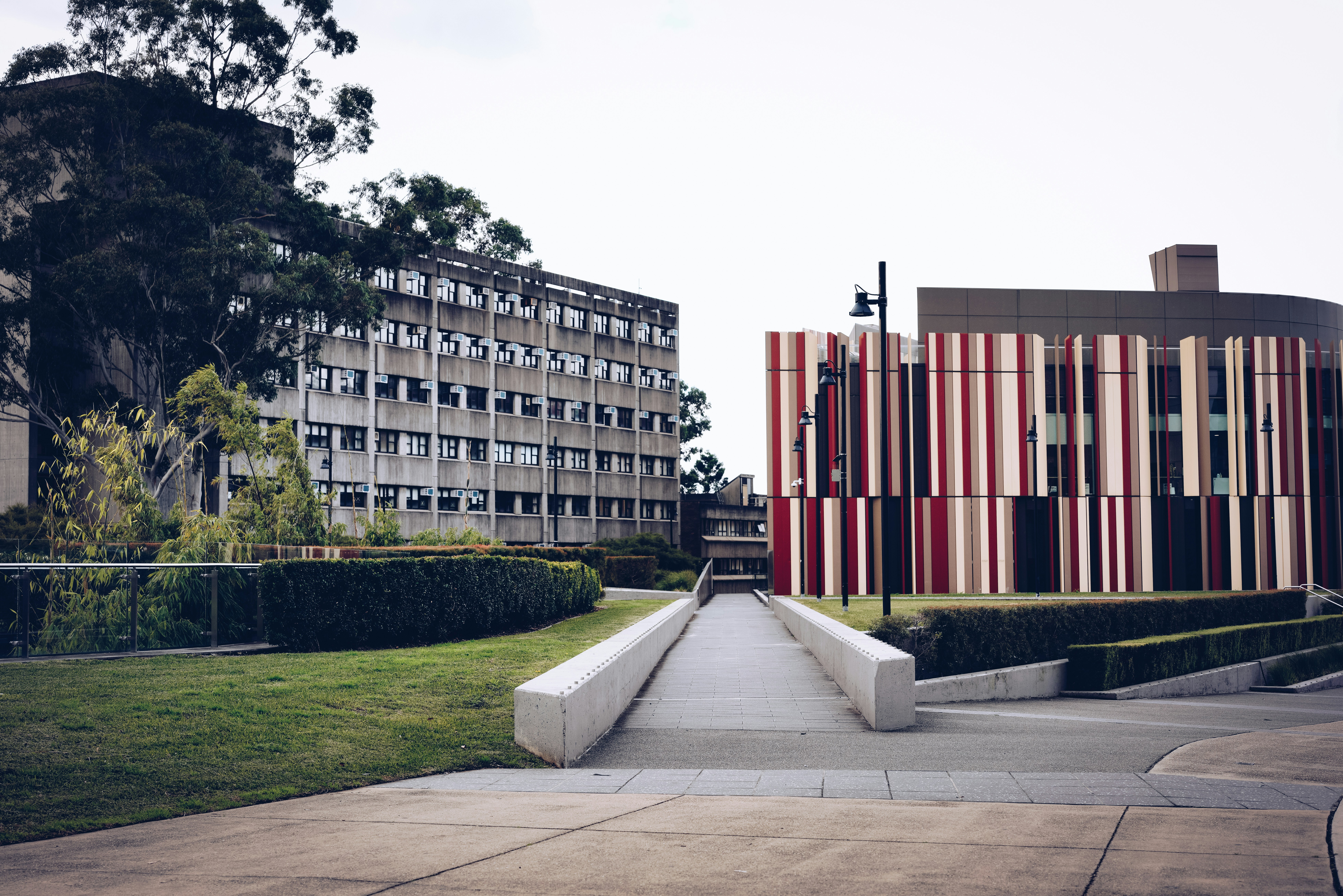 green grass field near brown concrete building during daytime