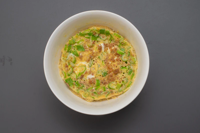 Baked savoury oat and herb bowl