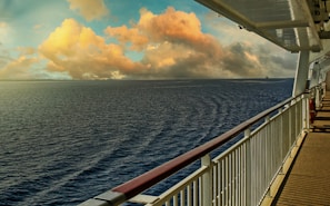 Ocean waves seen from a cruise ship balcony at sunrise.