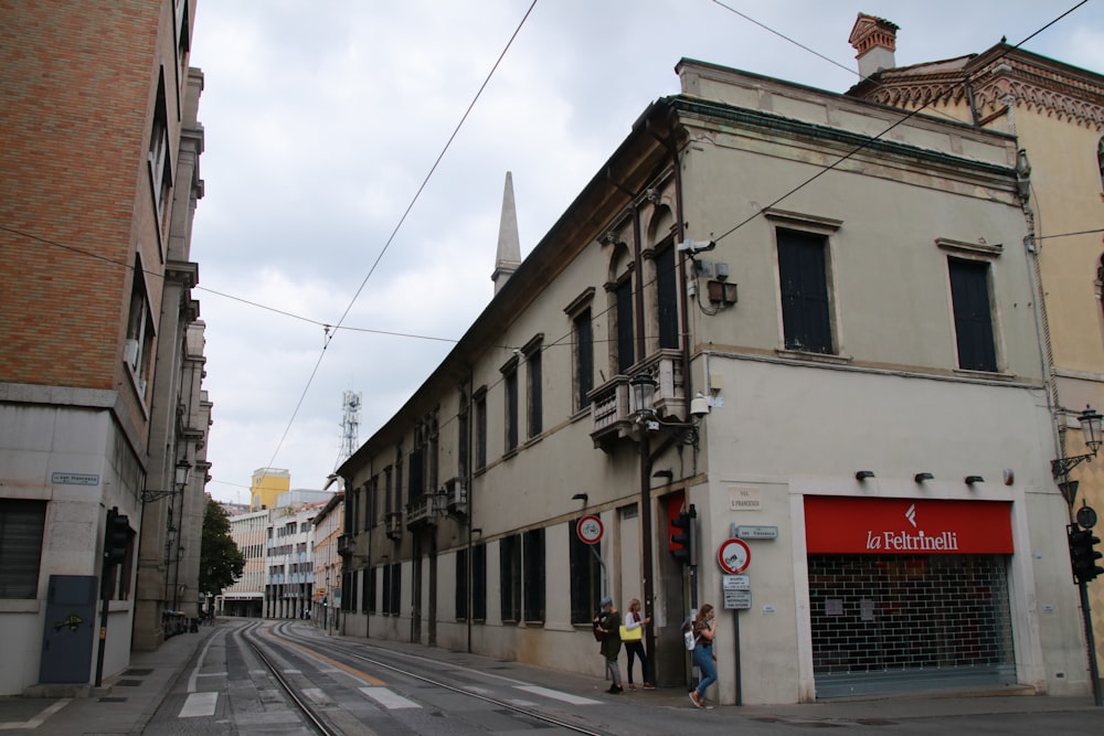 white and brown concrete building near road during daytime