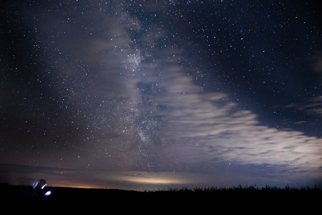 silhouette of mountain under blue sky during night time