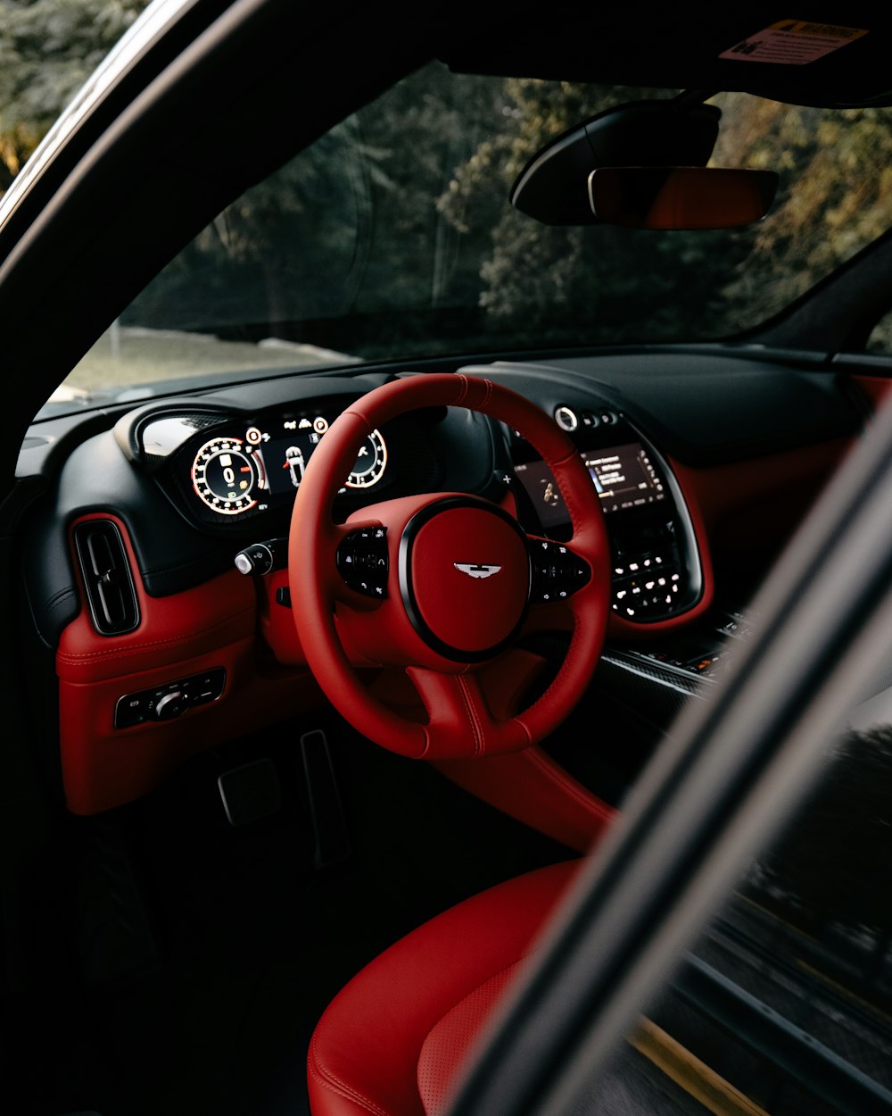 red and black car steering wheel