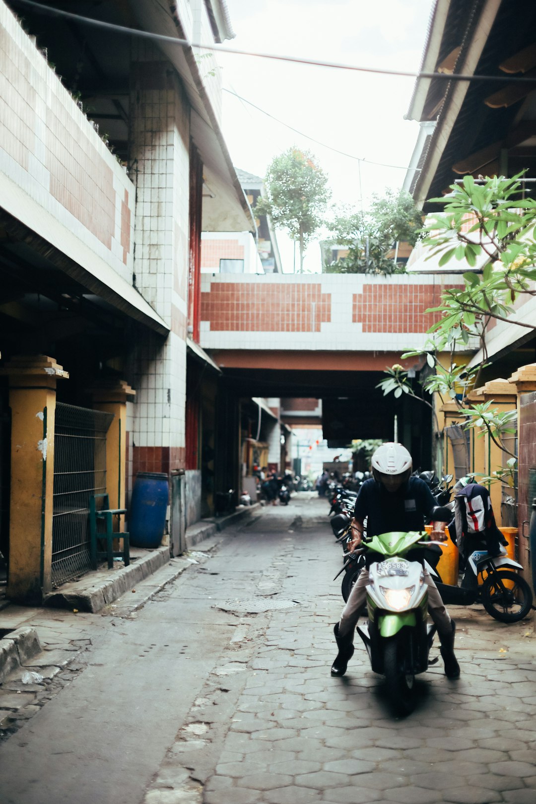 man in black jacket riding on yellow motorcycle during daytime