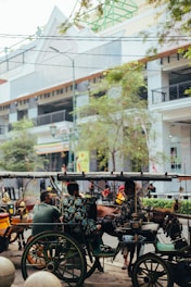 people riding on yellow and black vehicle during daytime