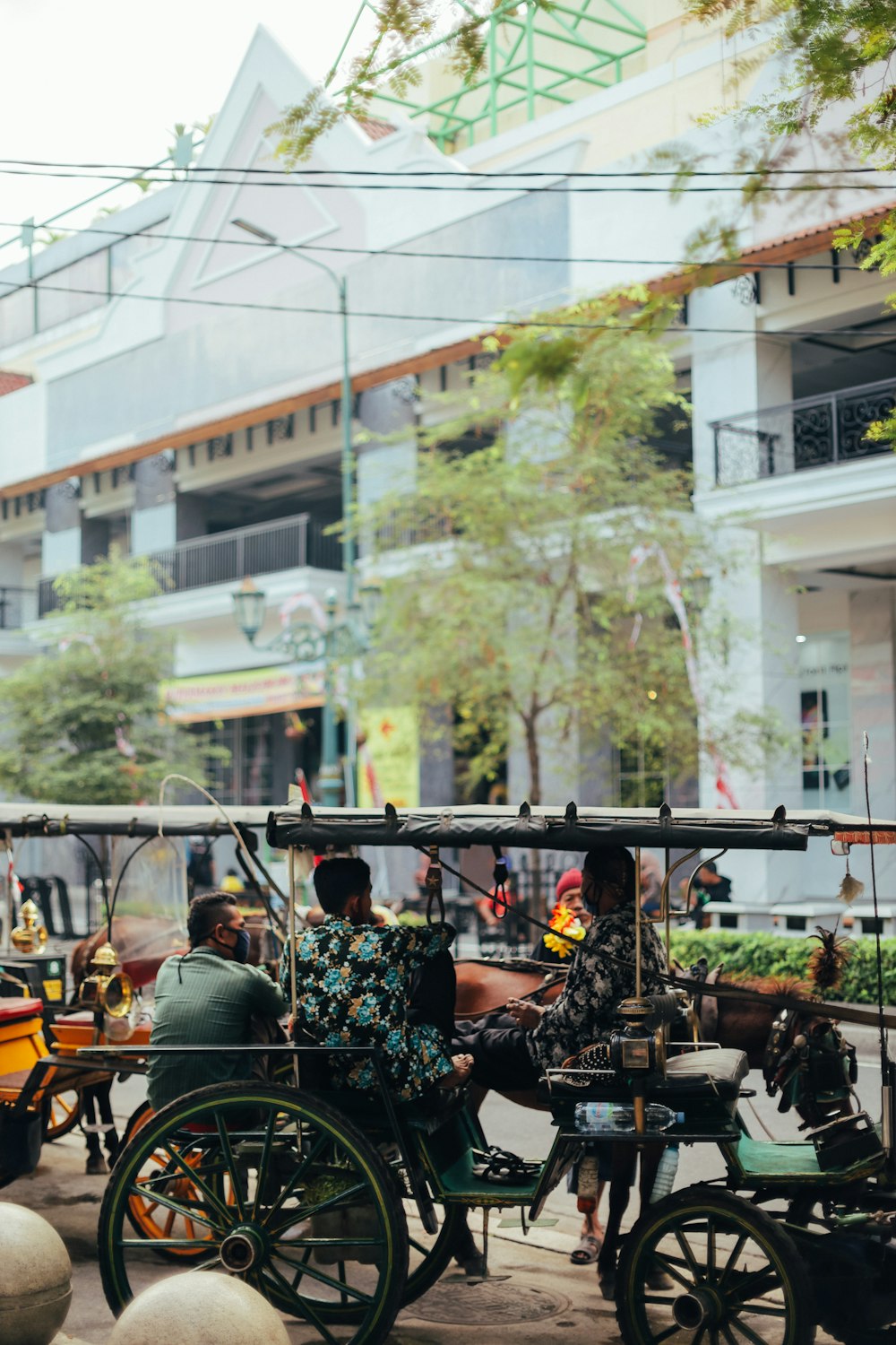 people riding on yellow and black vehicle during daytime