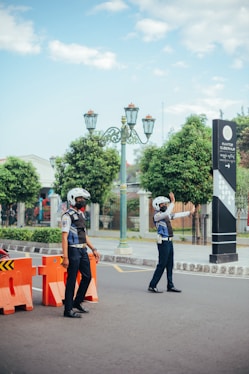 a couple of people that are standing in the street