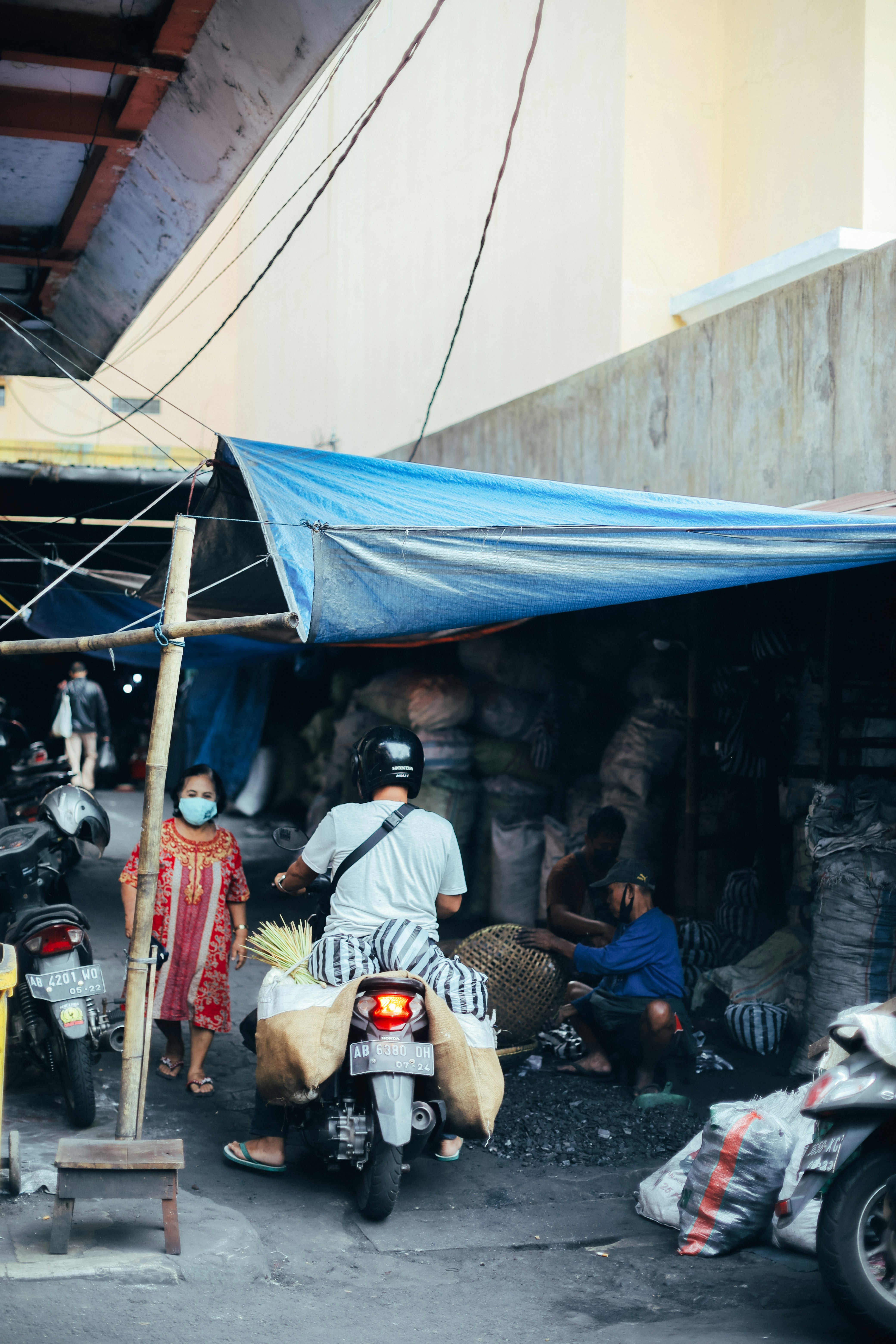 a man riding a motorcycle down a street