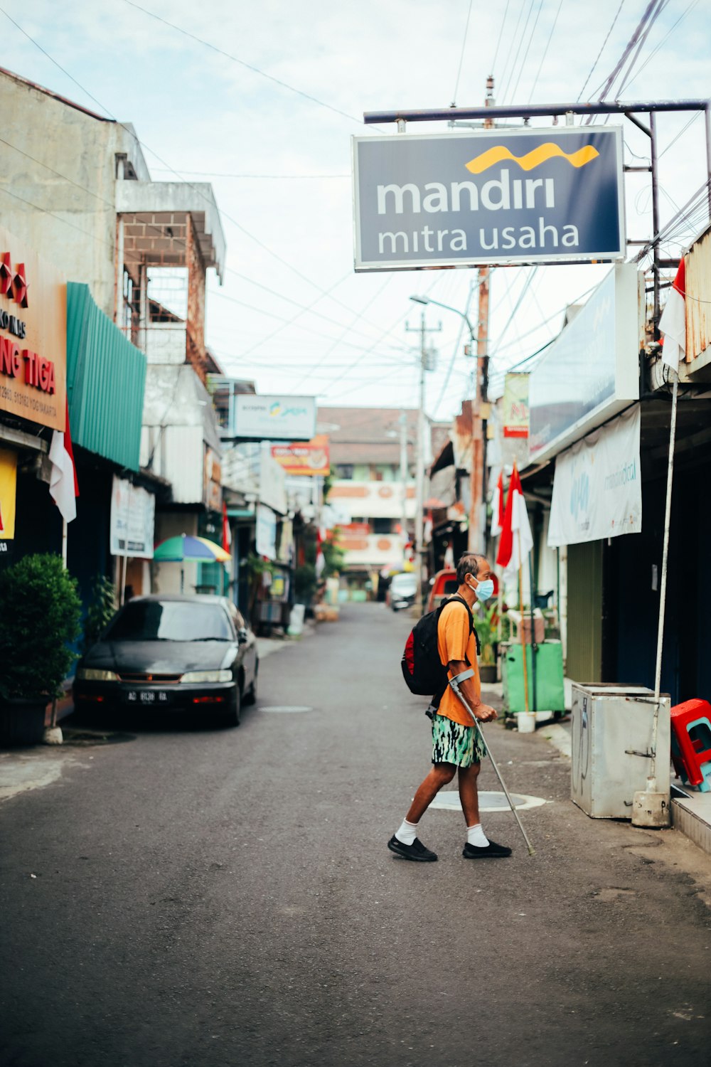 a person walking down a street with a backpack