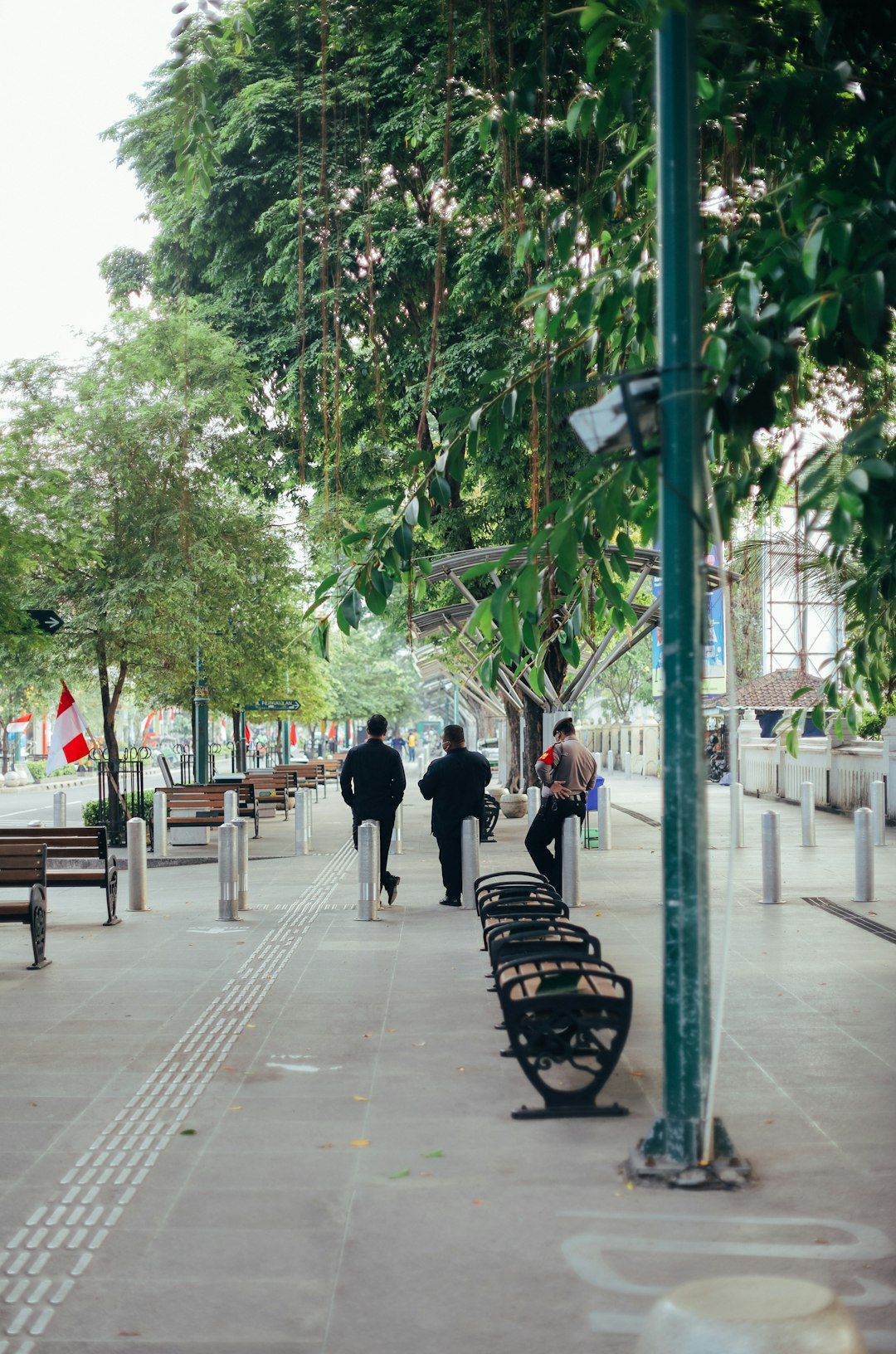 people walking on sidewalk during daytime