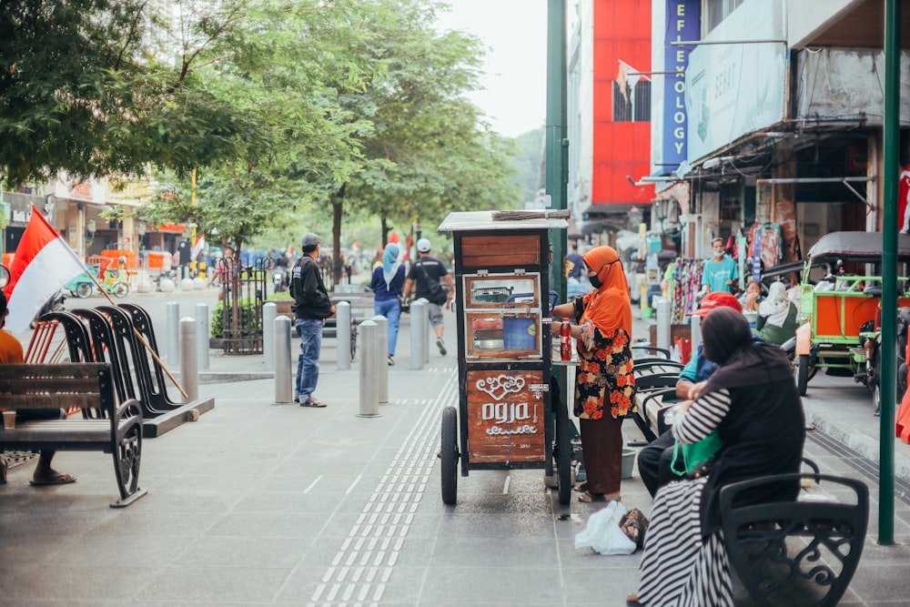 people walking on sidewalk during daytime