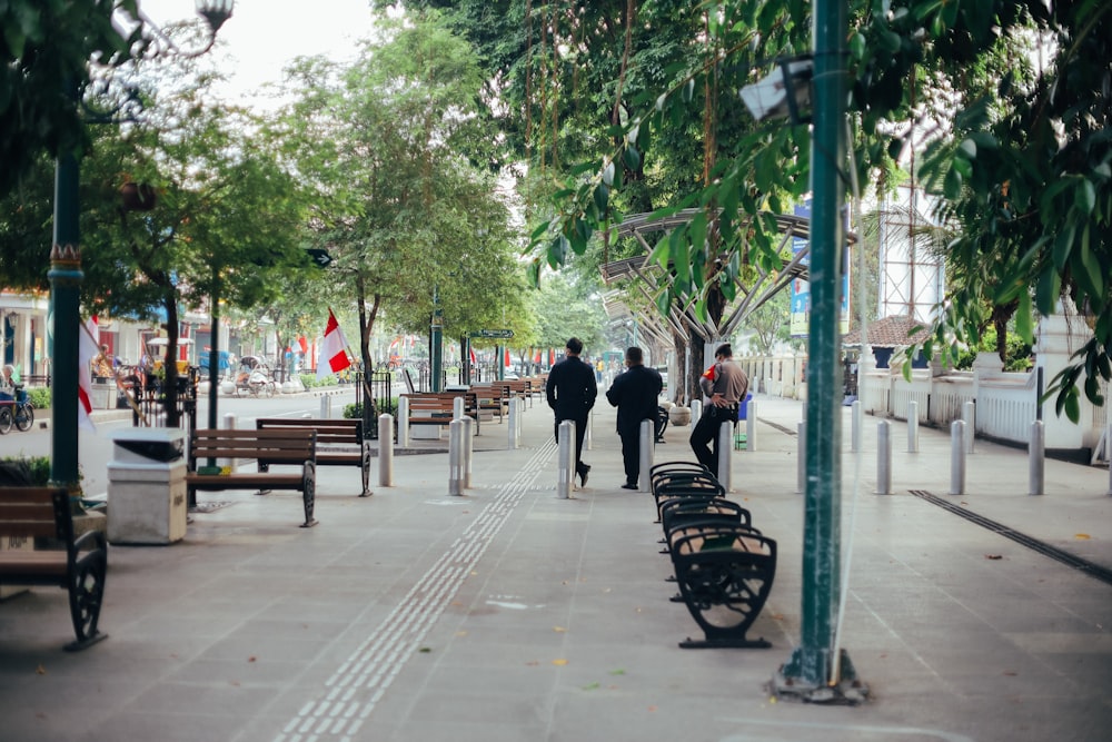 people walking on sidewalk during daytime