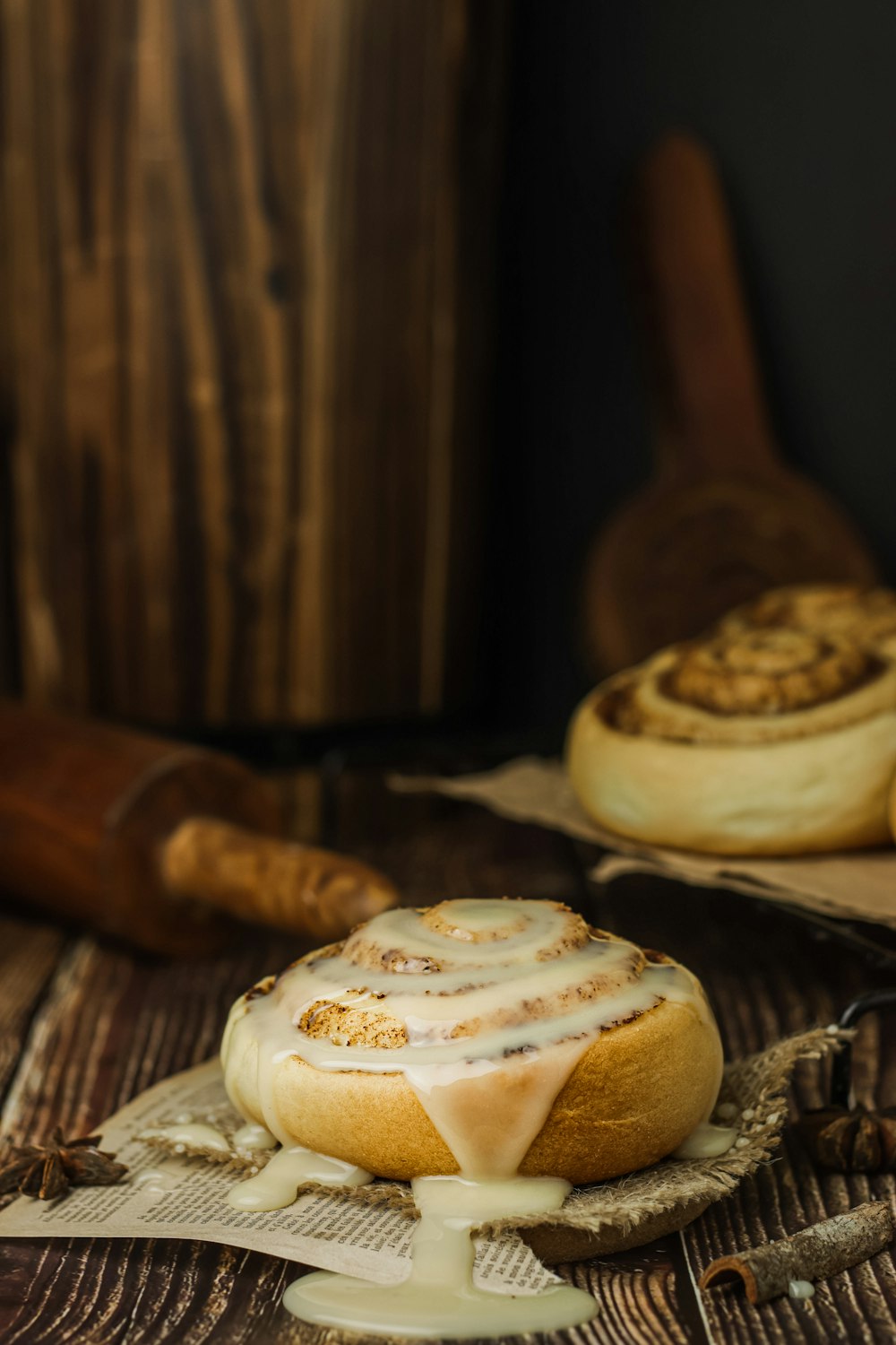 brown wooden spoon beside white and brown round cake