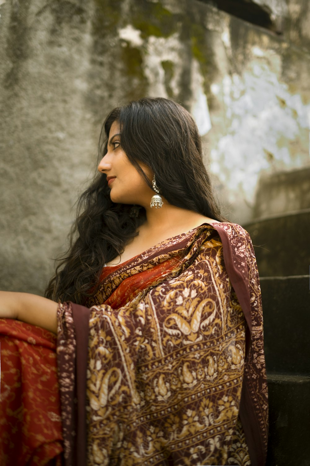 woman in red and gold sari