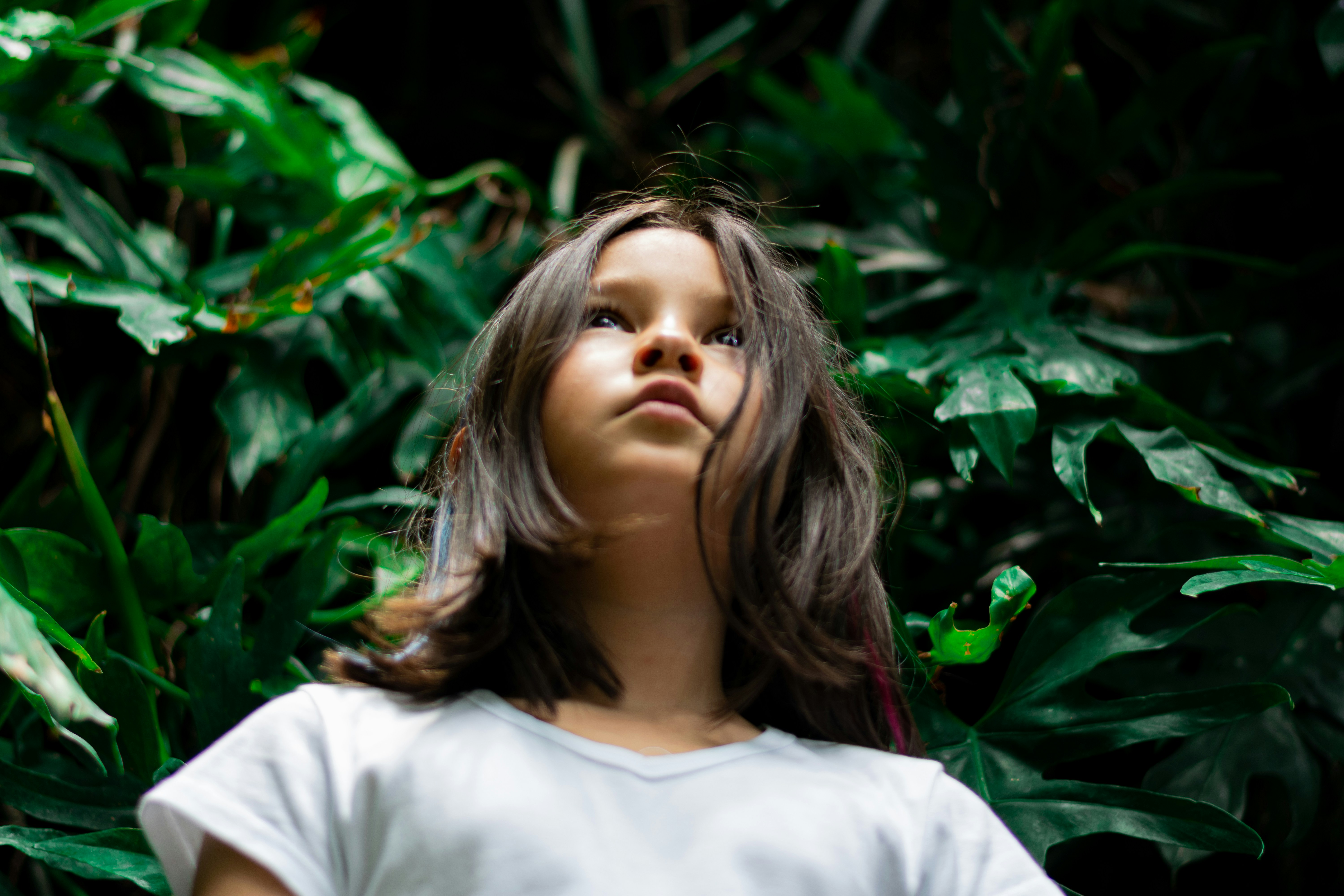 woman wearing yellow long-sleeved dress under white clouds and blue sky during daytime