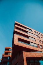 brown concrete building under blue sky during daytime