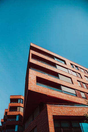 brown concrete building under blue sky during daytime