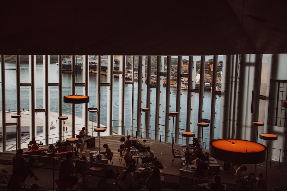 people sitting on chairs inside building