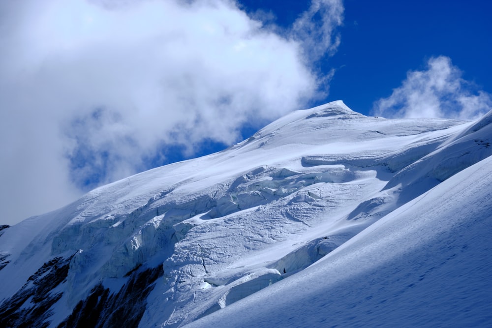 snow covered mountain under blue sky during daytime