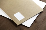 white paper on brown wooden table
