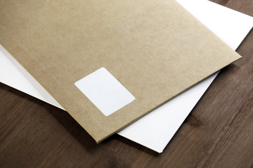 white paper on brown wooden table