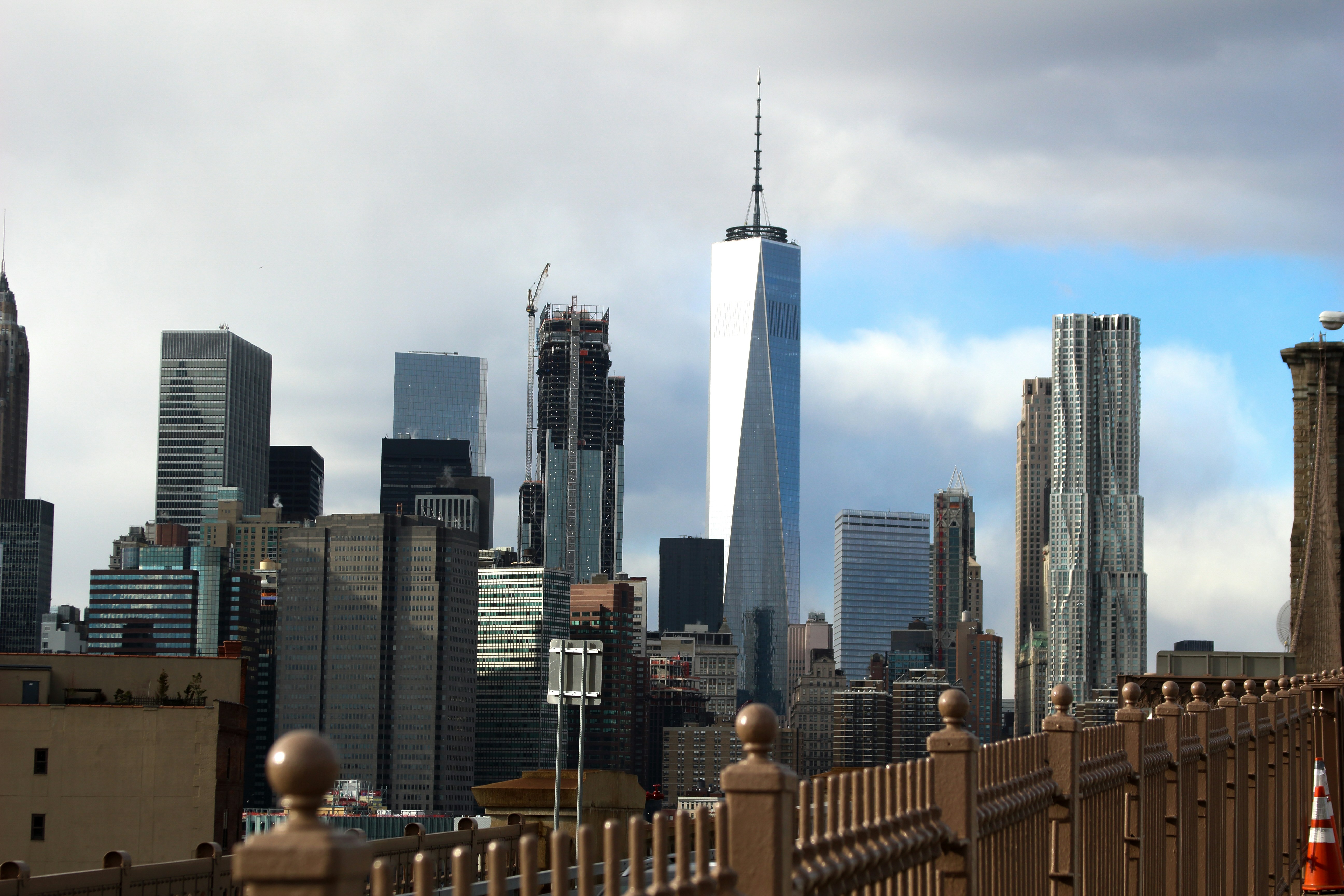 city skyline under gray sky during daytime