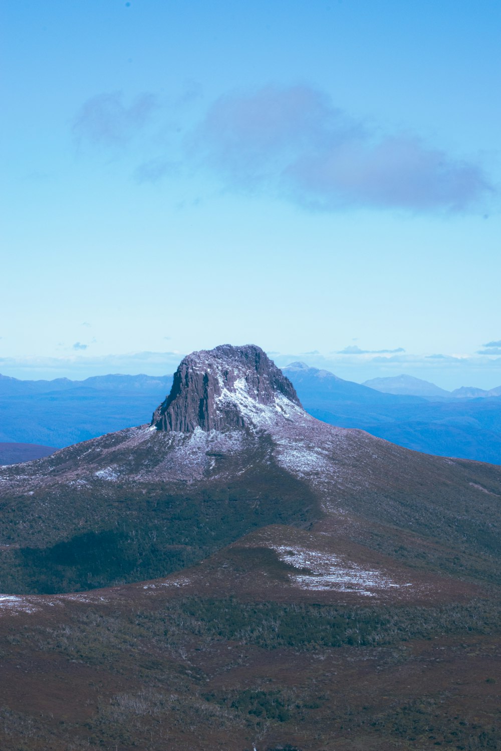 gray and white mountain under white sky during daytime