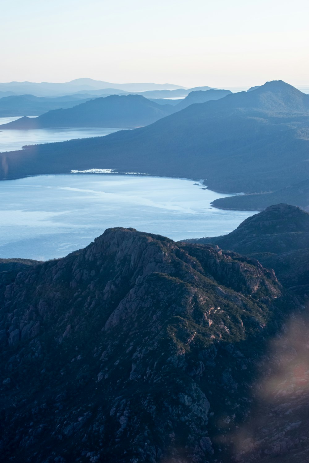 aerial view of lake and mountains during daytime