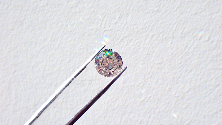 A single diamond held in fine tweezers
