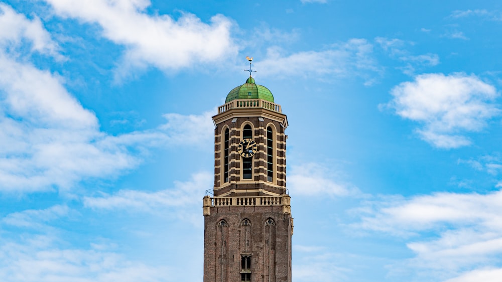 brown and green concrete building under blue sky during daytime