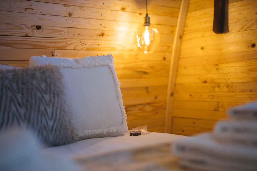 white pillow on white bed