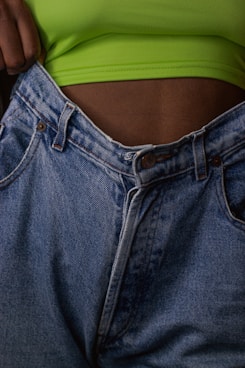 person in blue denim jeans