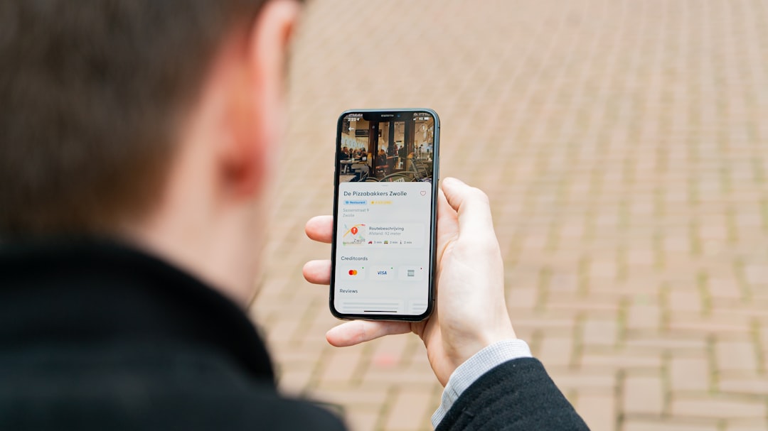 A ride-hailing app showing a map with live car tracking and driver details on a smartphone.