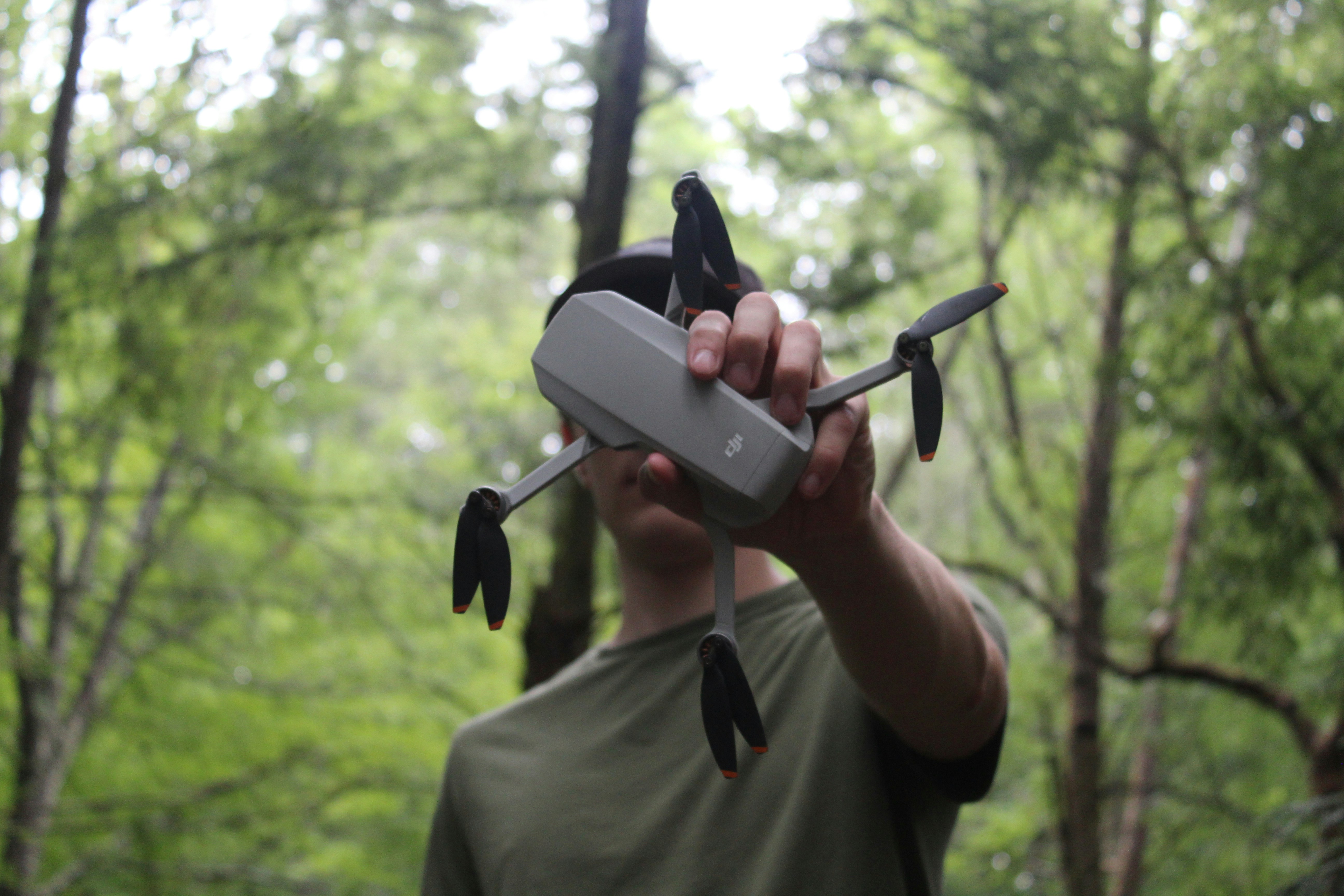 person holding black and gray metal tool