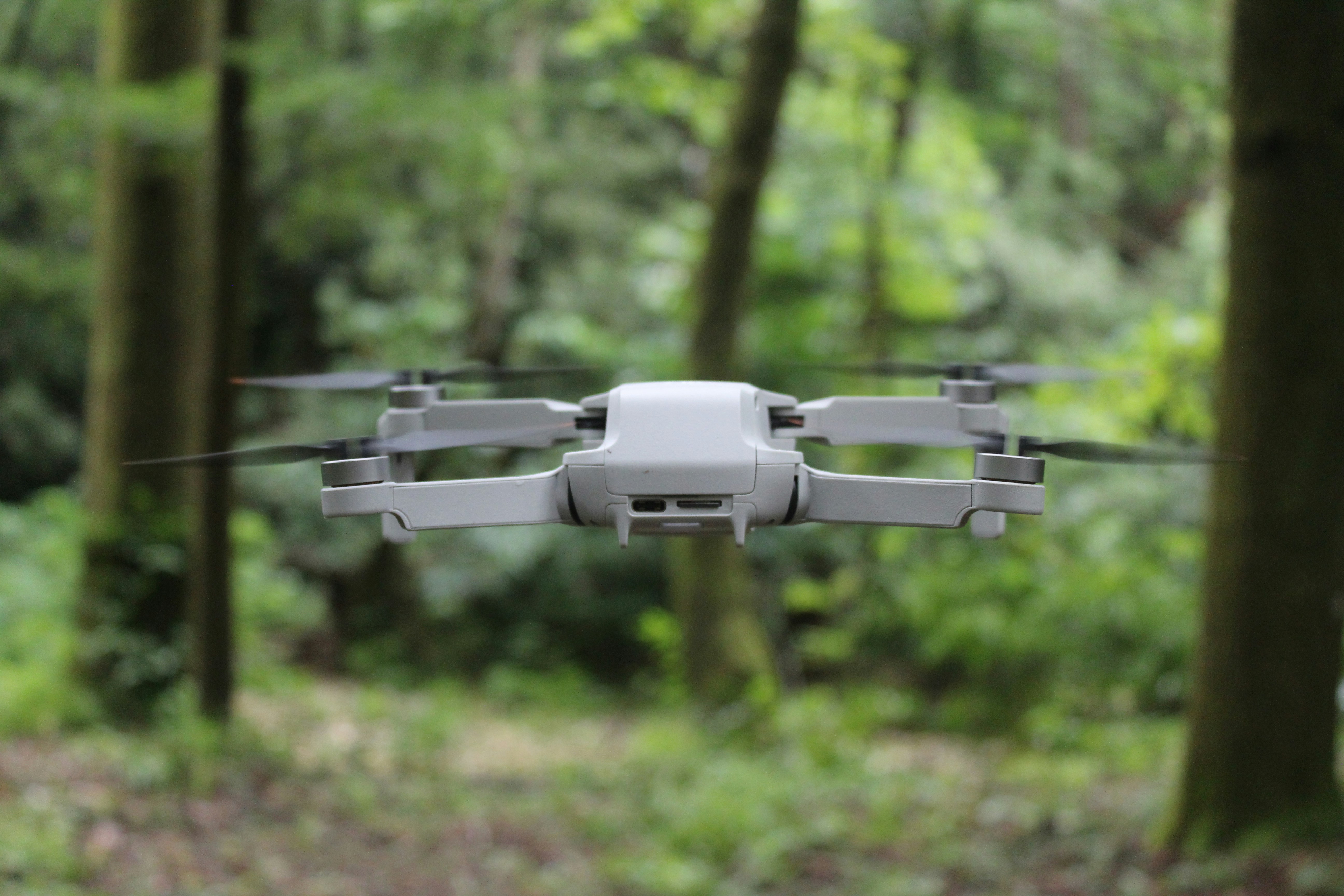 white and gray drone in tilt shift lens
