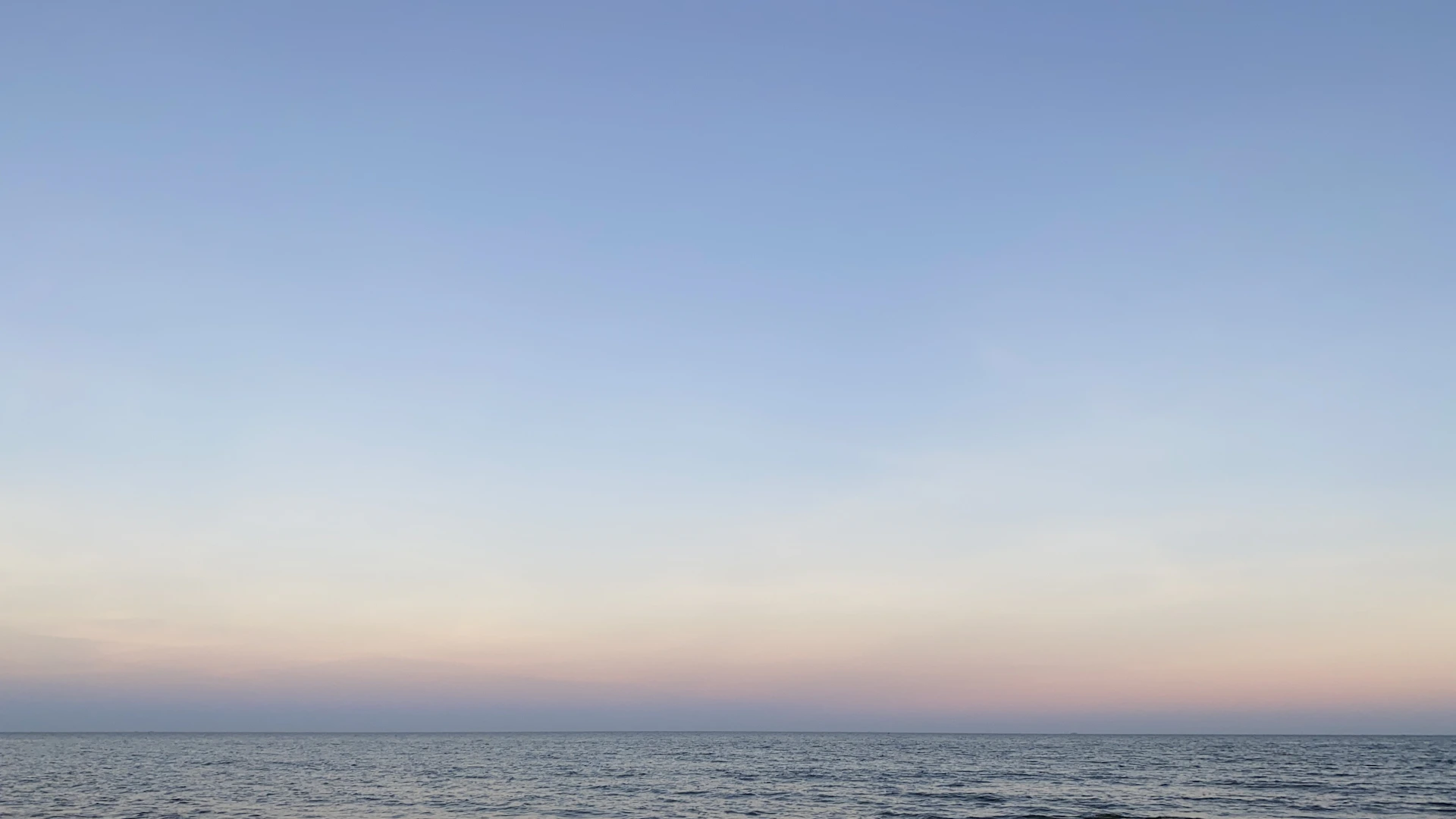 body of water under blue sky during daytime