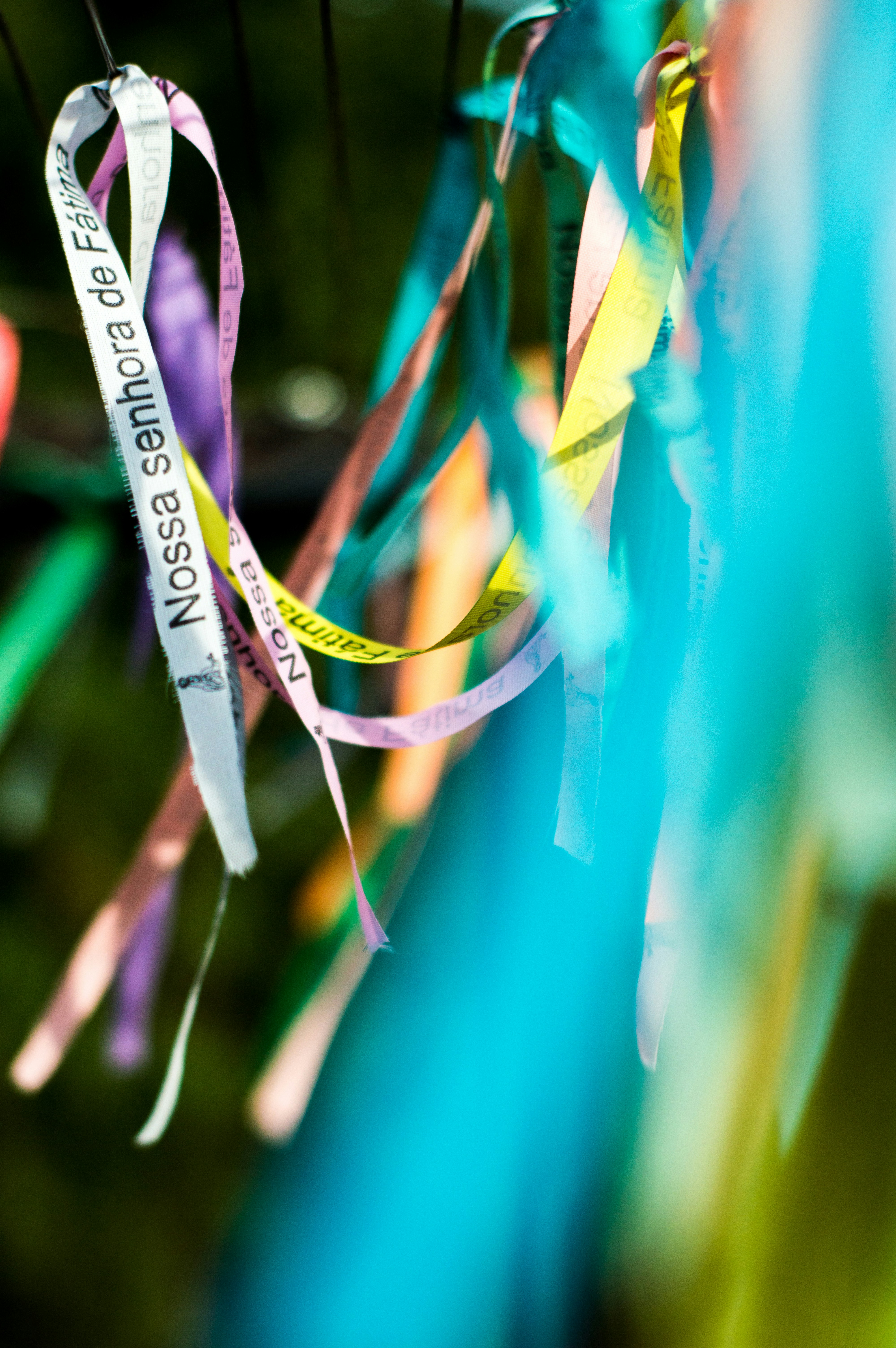 purple and green strap on green textile