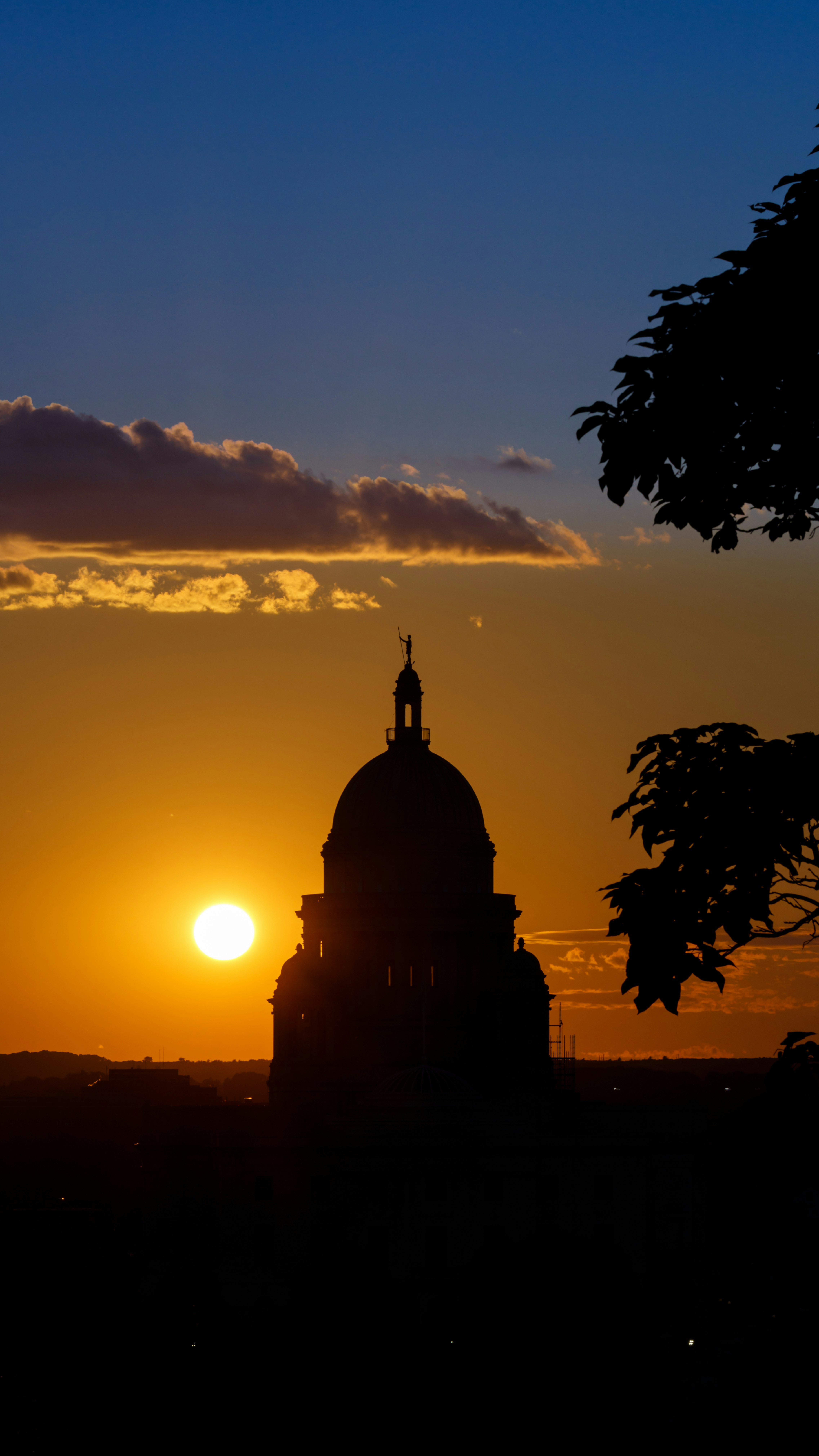 silhouette of building during sunset